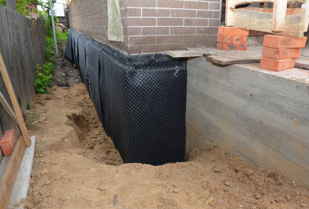 Happy homeowners after waterproofing job in Beverly Shores